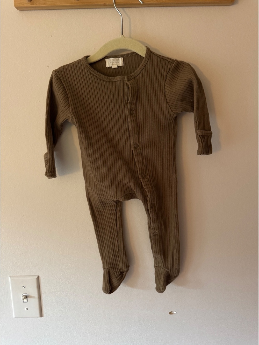 The simple folk button down footed one piece romper
